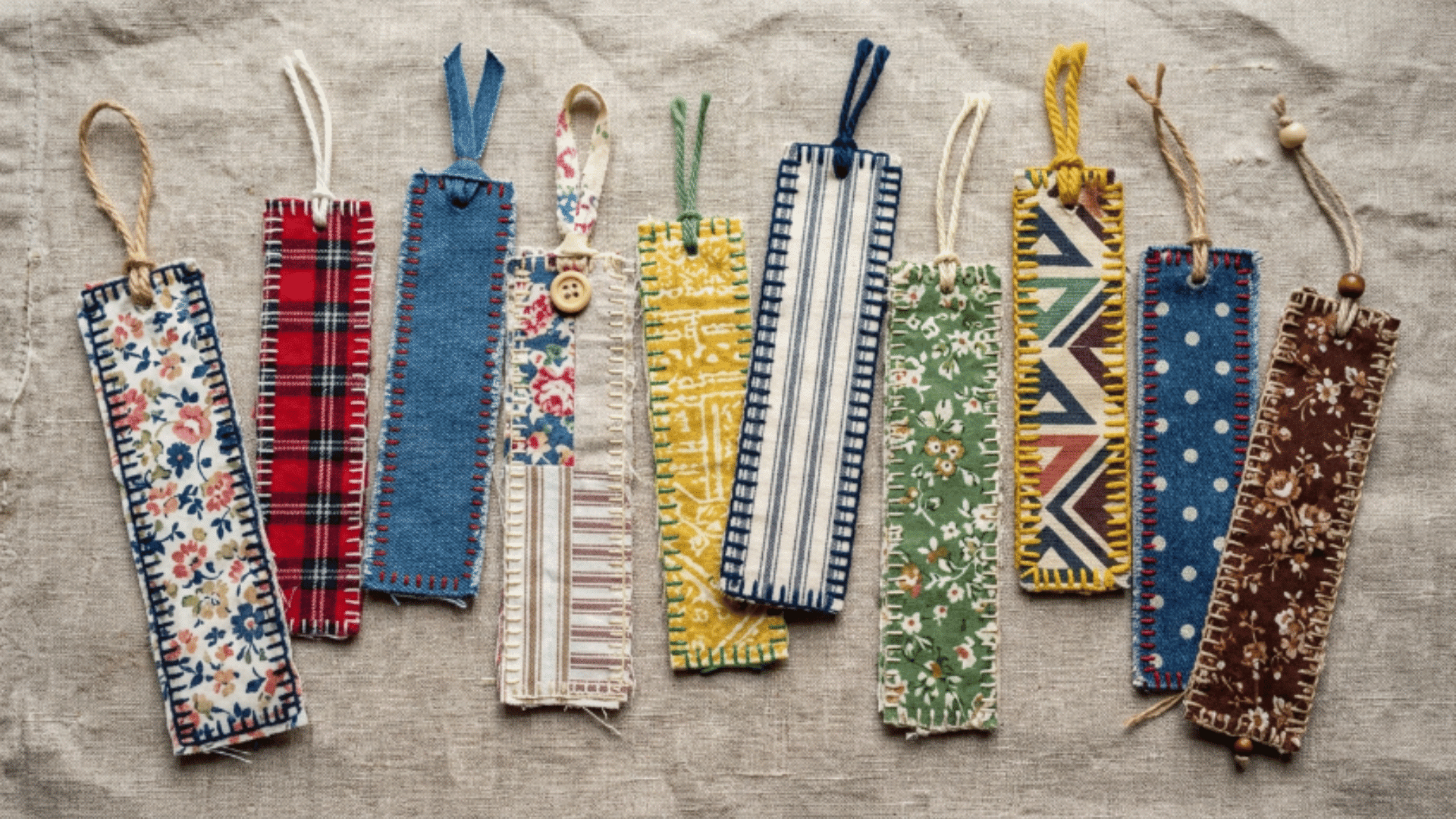 fabric bookmarks made from scrap cloth with textures arranged on neutral background with soft lighting