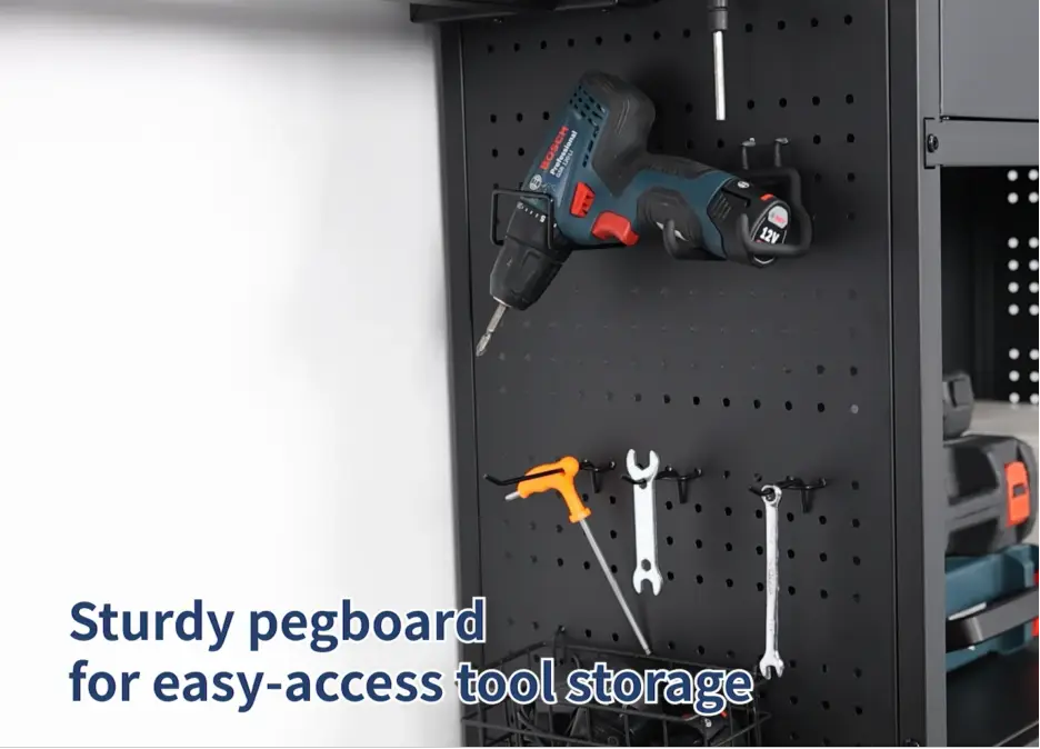 Power drill and wrenches on black pegboard in neat garage workspace