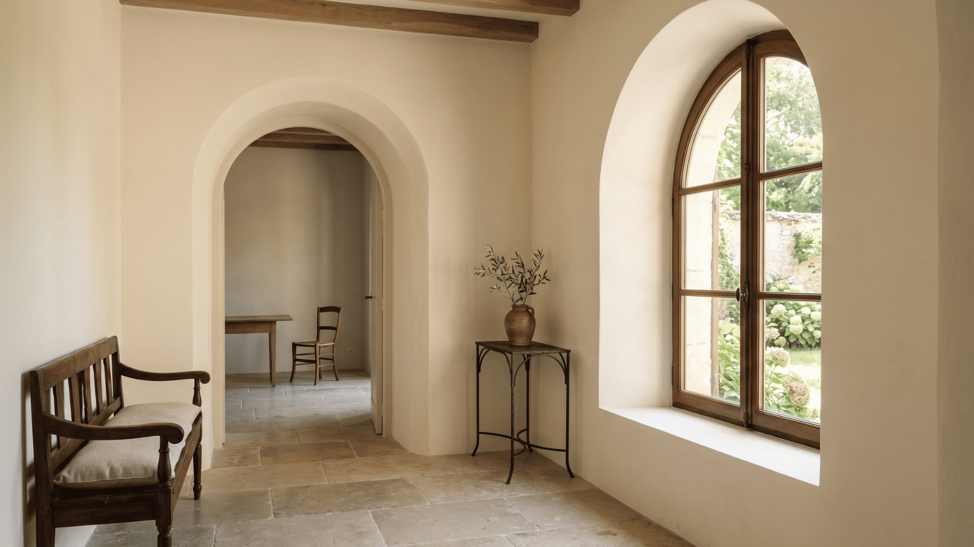 french country interior with arched doorway and smooth polished walls with soft natural light