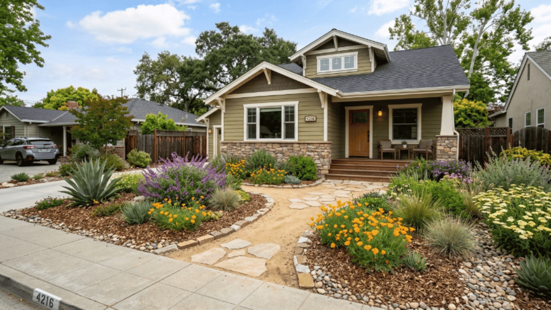 front yard with native plants, mulch beds, and a natural layout, designed for low water use and easy maintenance