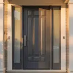home entrance with a dark paneled front door, glass sidelights, and white columns