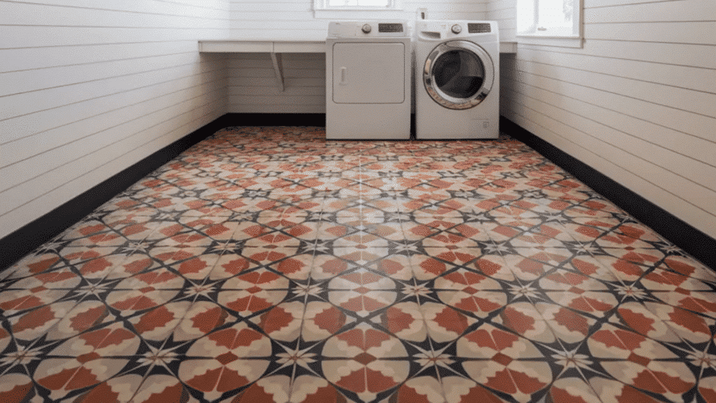 laundry room with white shiplap walls, patterned tile floor, and washer dryer under window