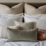 layered bed with Euro shams at the back, standard pillows in the middle, and decorative throw pillows in front creating a balanced arrangement