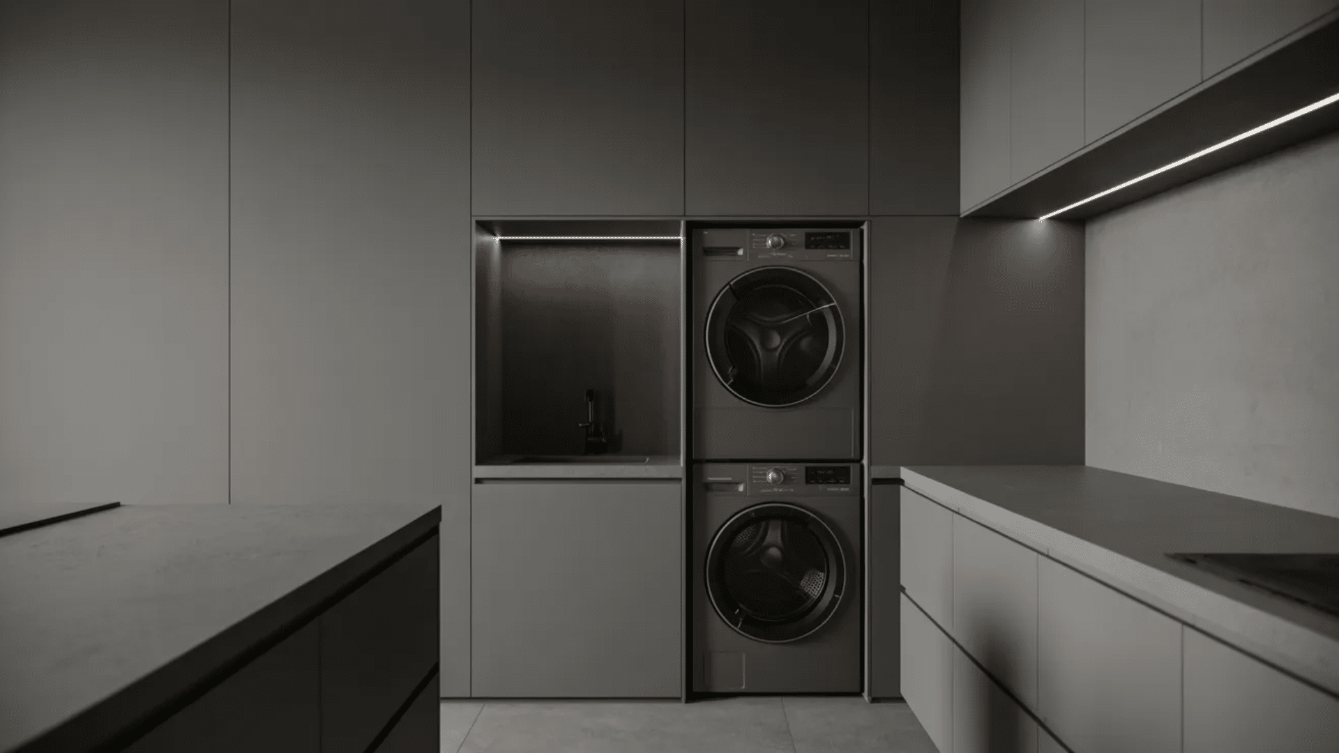minimal dark laundry room with stacked washer dryer, hidden cabinets, and sleek lighting
