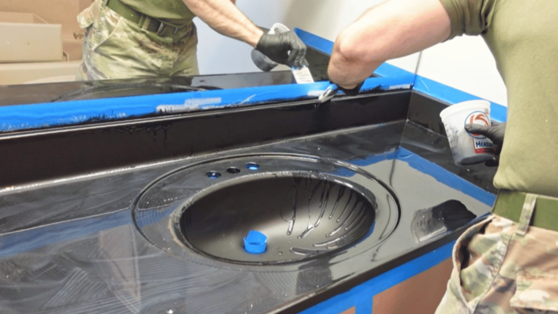 mix and spread epoxy evenly across vanity surface for smooth coating