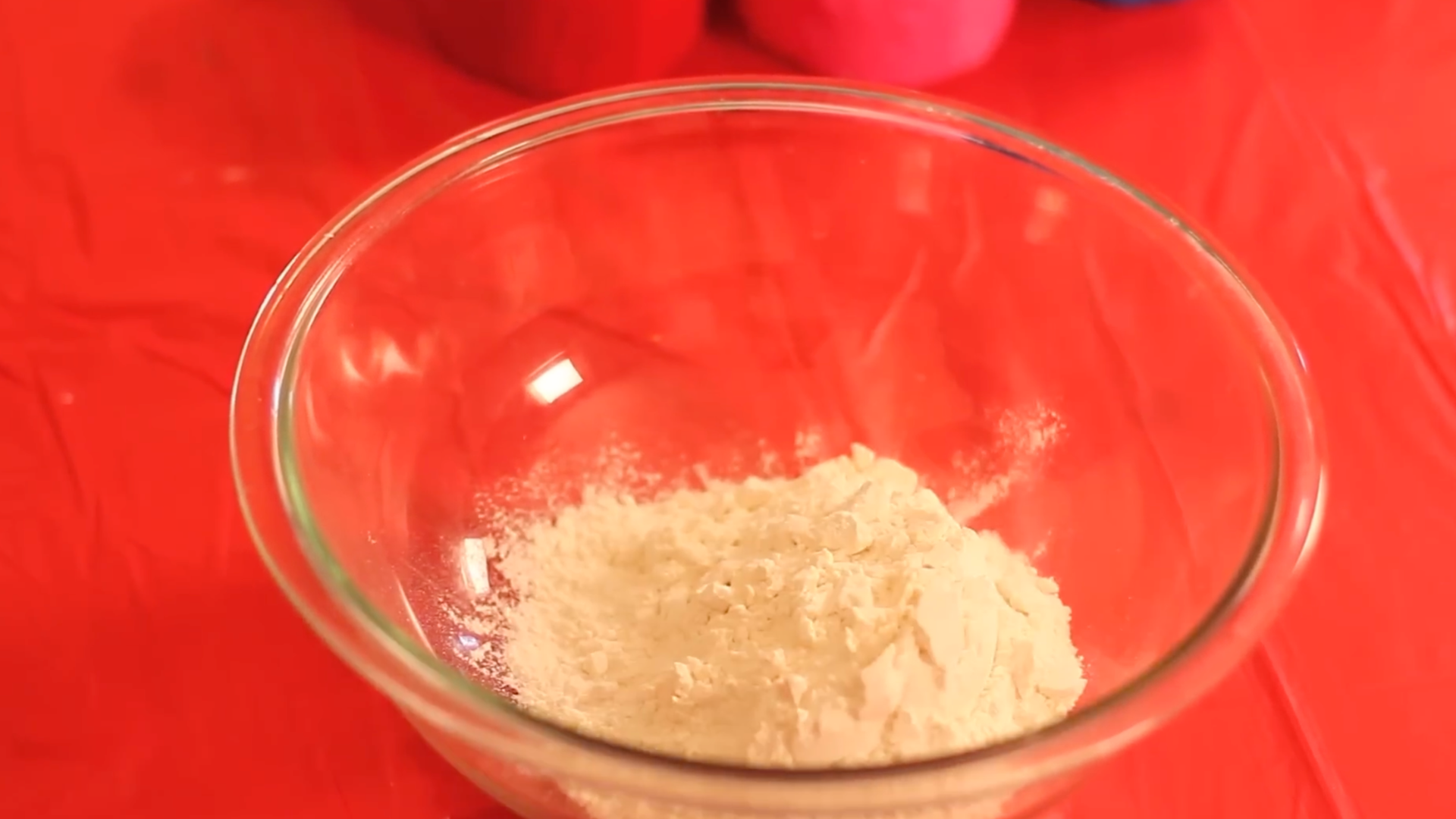 mixing flour and water in a bowl until smooth to prepare paper mache paste for layering