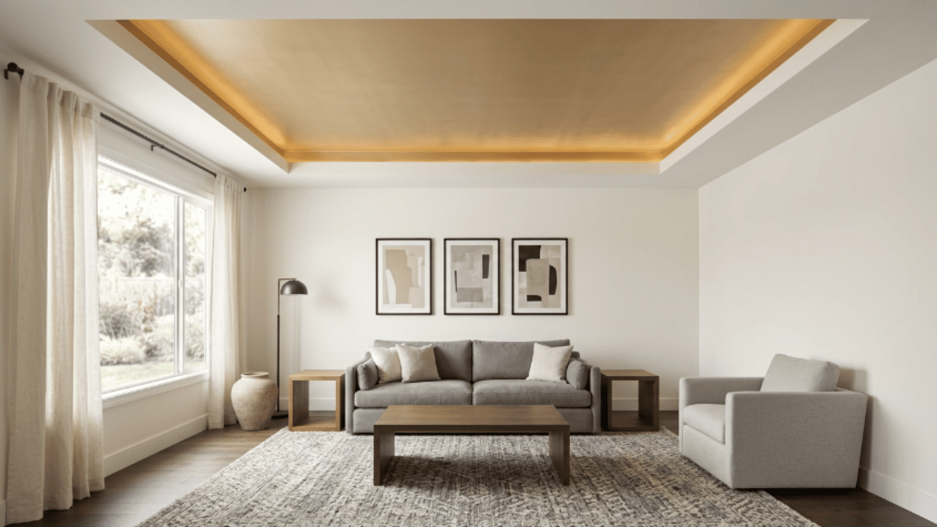 modern interior with tray ceiling featuring a gold-toned recessed center adding warmth