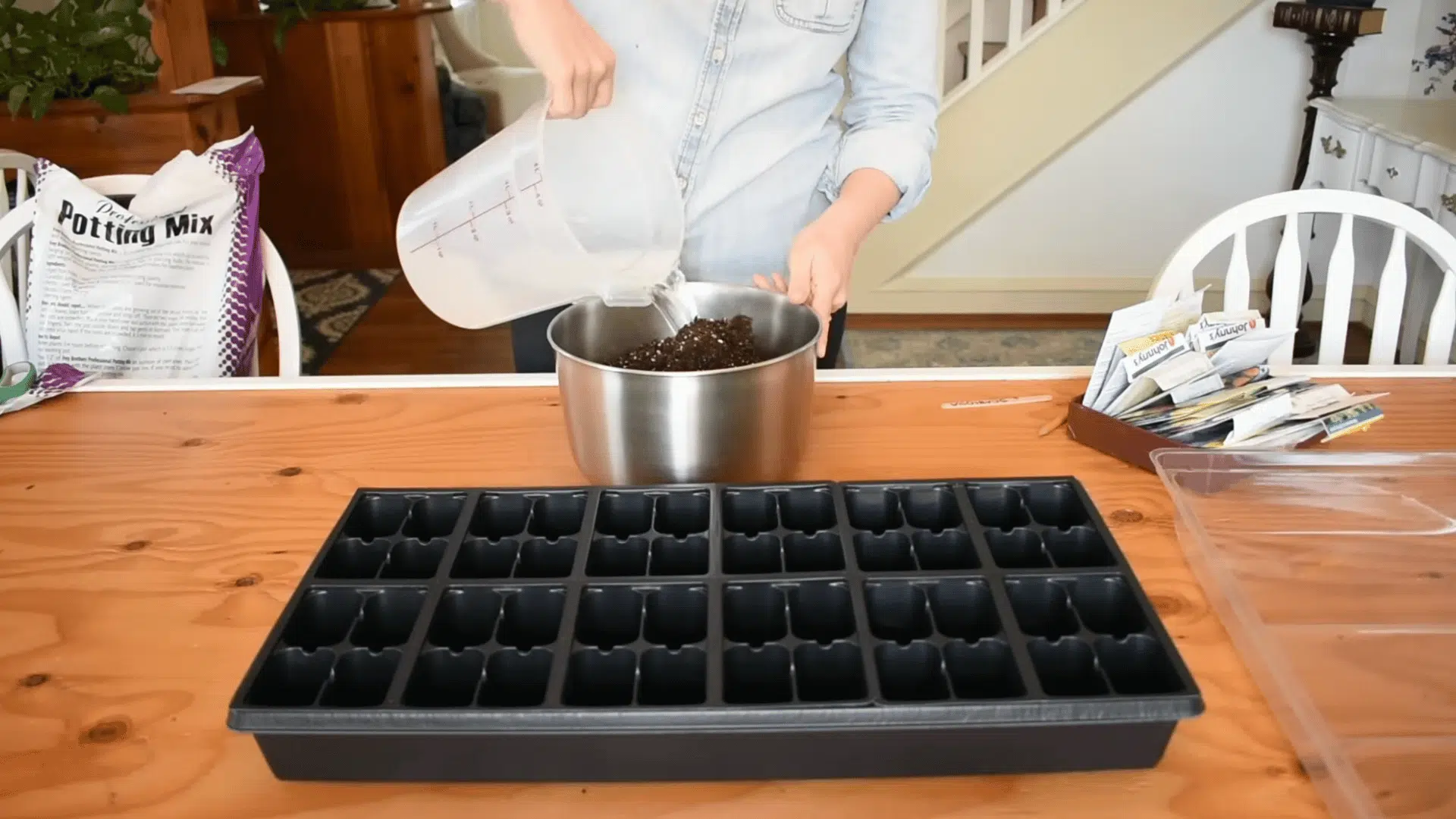 moist seed starting soil mixed in a bowl until evenly damp to prepare a healthy base for indoor seed planting for seeds