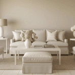 monochromatic beige living room with neutral sofa, armchairs, and decor creating a cohesive and elegant interior design