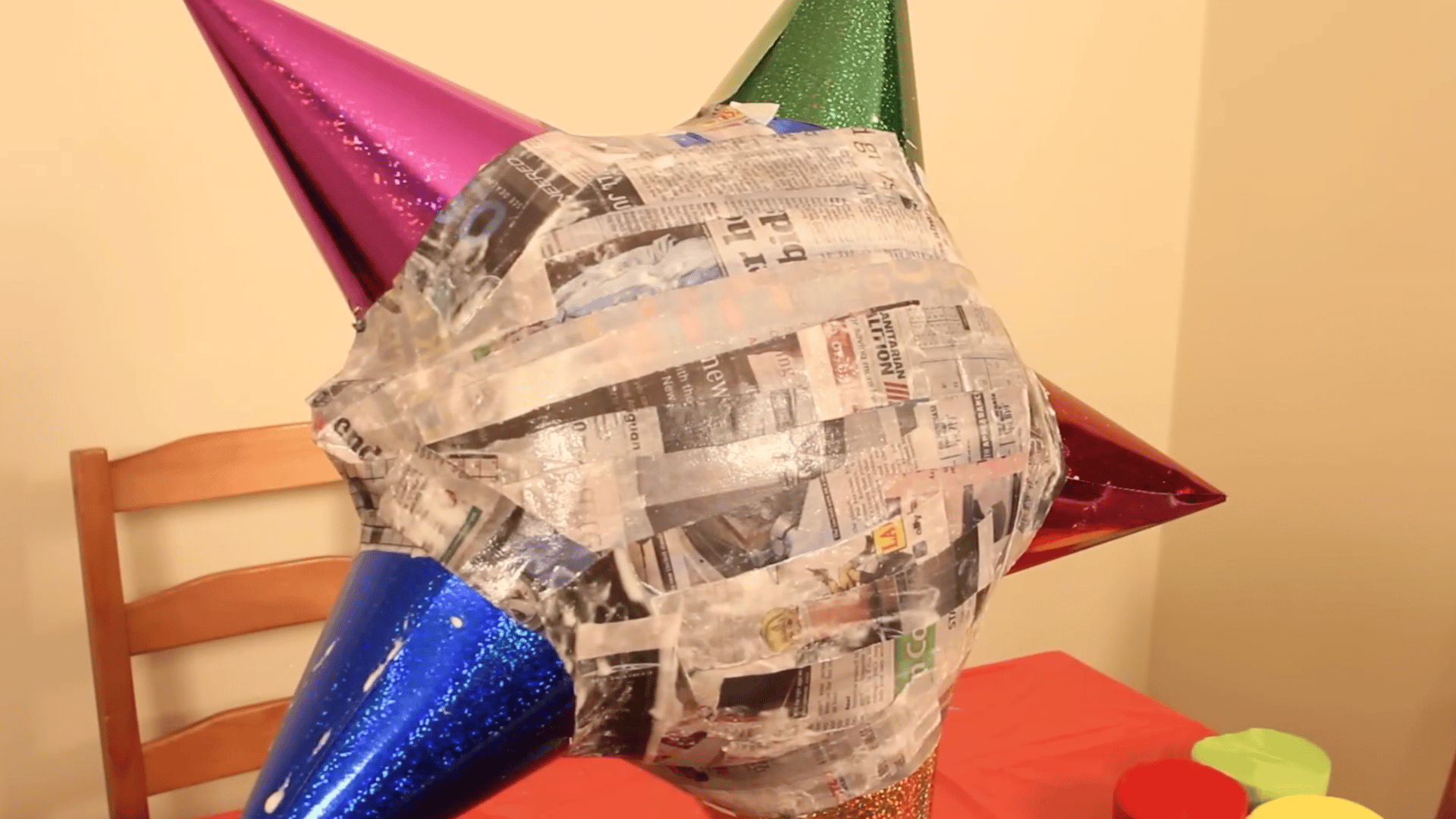 multiple layers of paper mache drying on balloon to create a strong and durable shell