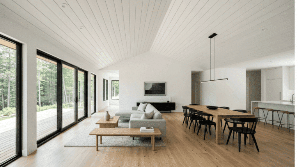 narrow shiplap planks create detailed lines across the ceiling, adding texture and movement to the space