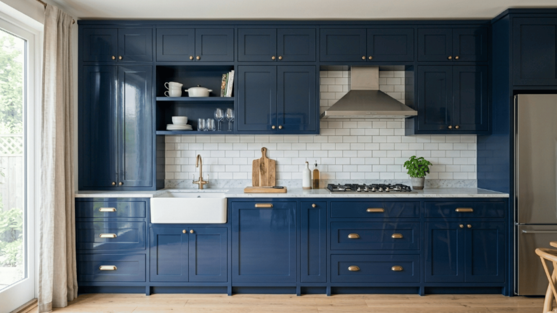 navy blue kitchen cabinets with gold hardware white farmhouse sink subway tile and marble countertops