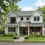 newly remodeled house with second floor addition and updated exterior design.