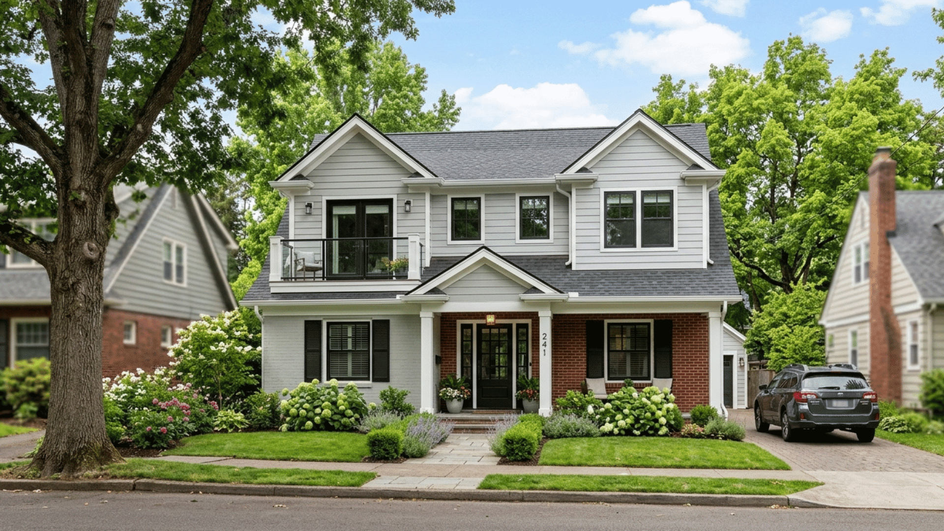 newly remodeled house with second floor addition and updated exterior design.