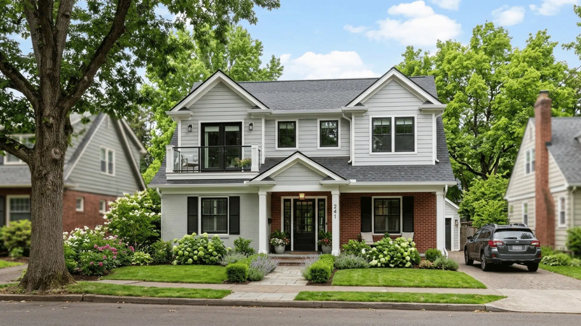 newly remodeled house with second floor addition and updated exterior design.
