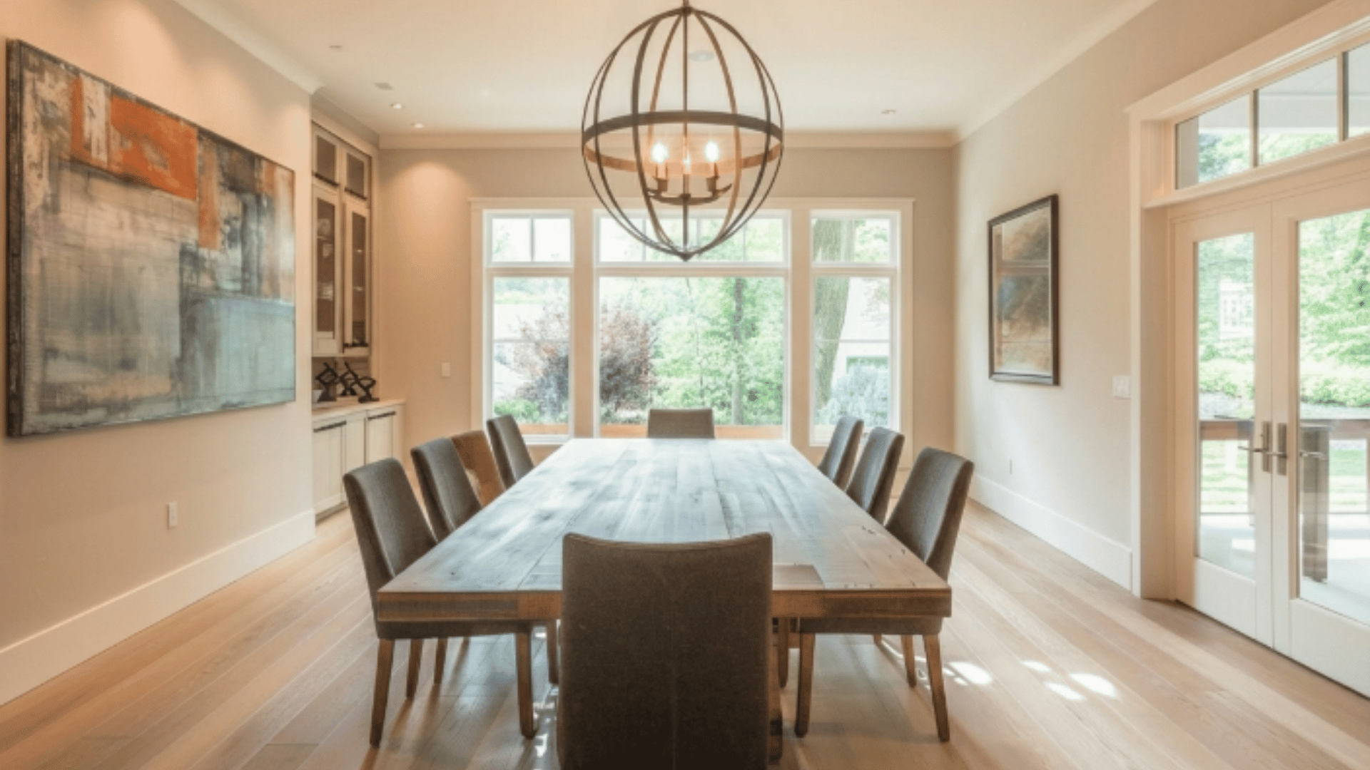 orb chandelier with round frame above dining table providing balanced lighting (1)