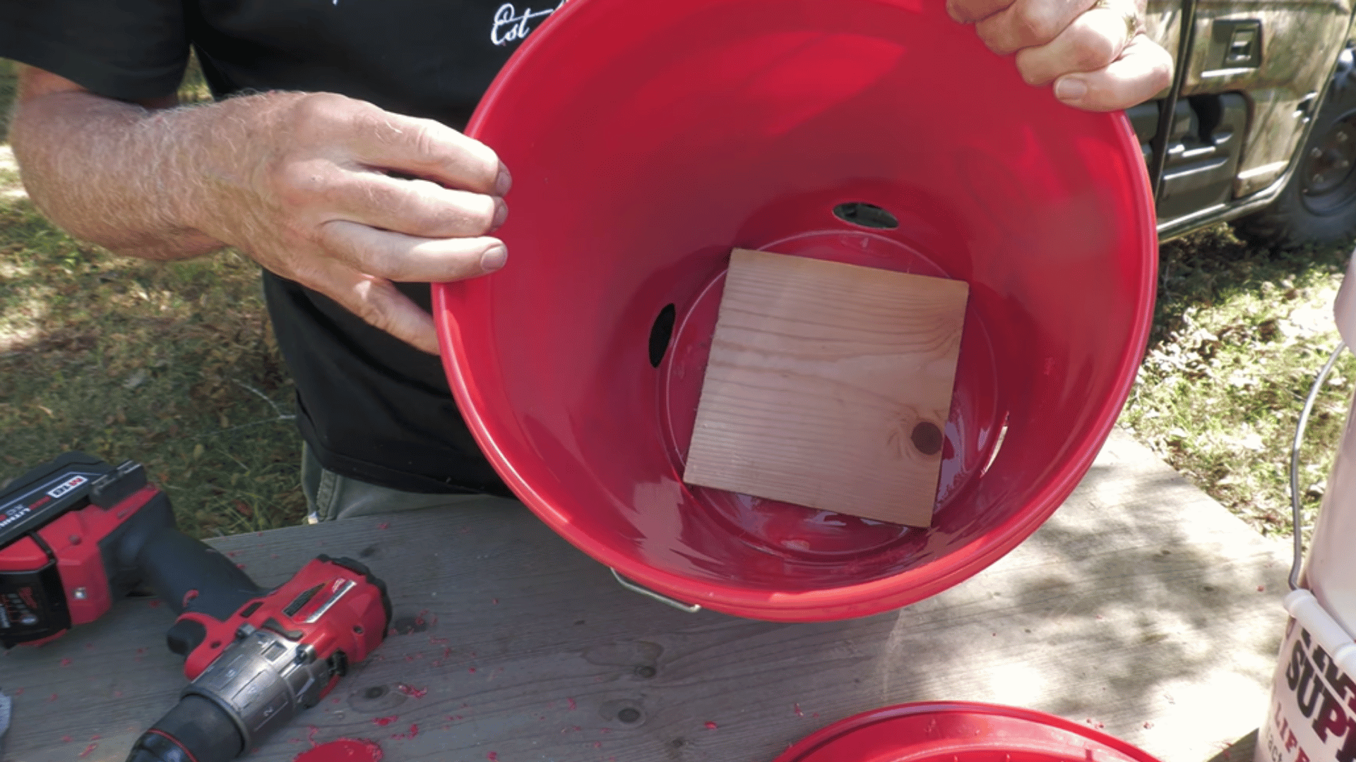 place a small piece of scrap wood inside the bottom of the bucket for support