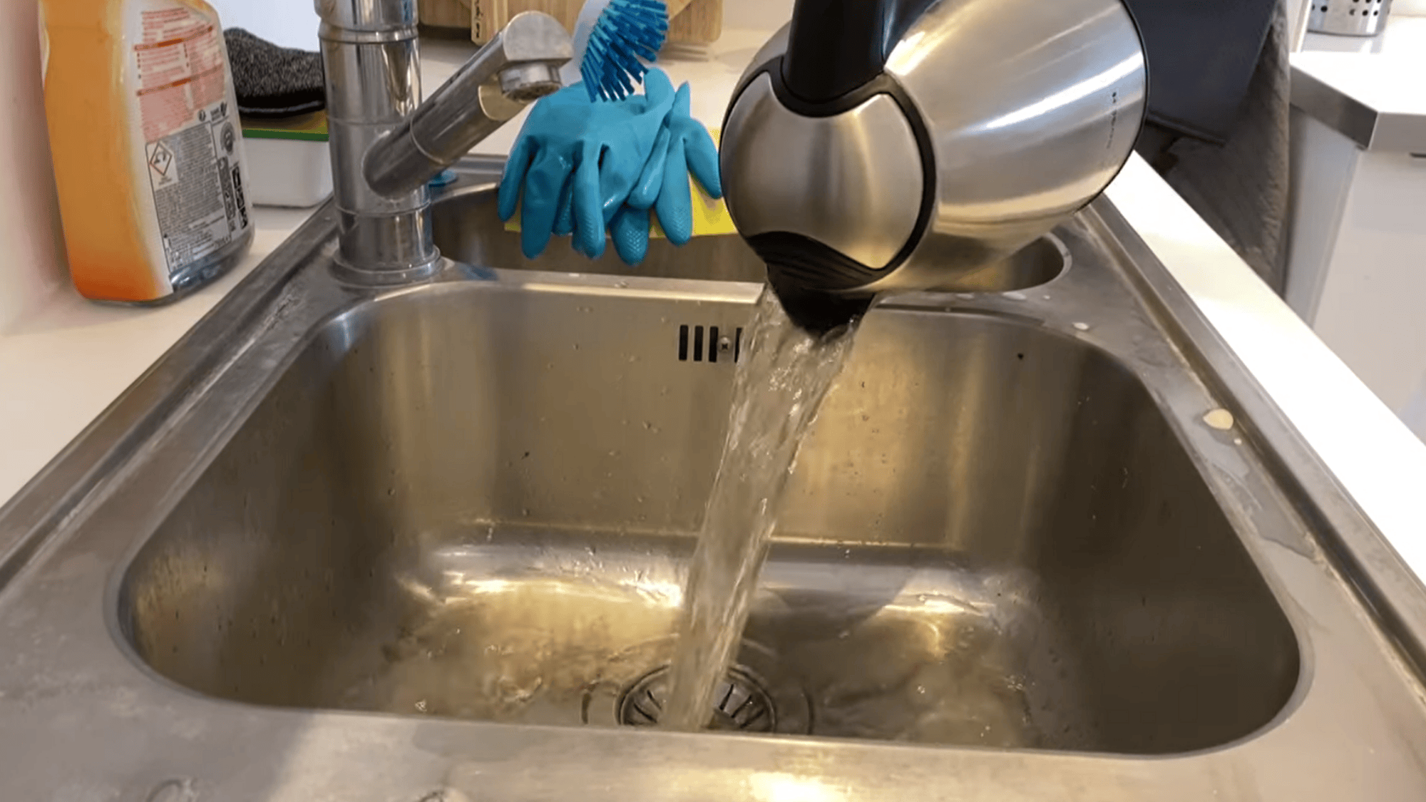 rinsing kettle and scrubbing stubborn stains