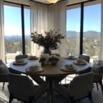 round dining table set for six with chairs large windows sheer curtains and scenic mountain view in bright room