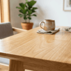 rubberwood dining table with light grain texture placed in a clean modern indoor setting with natural lighting and minimal decor