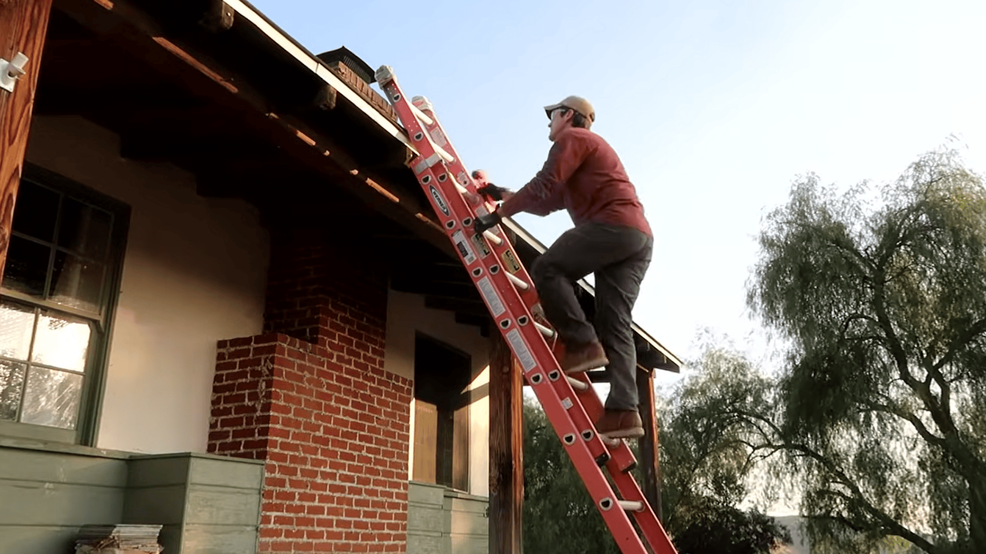 safely access roof and inspect chimney flue with flashlight