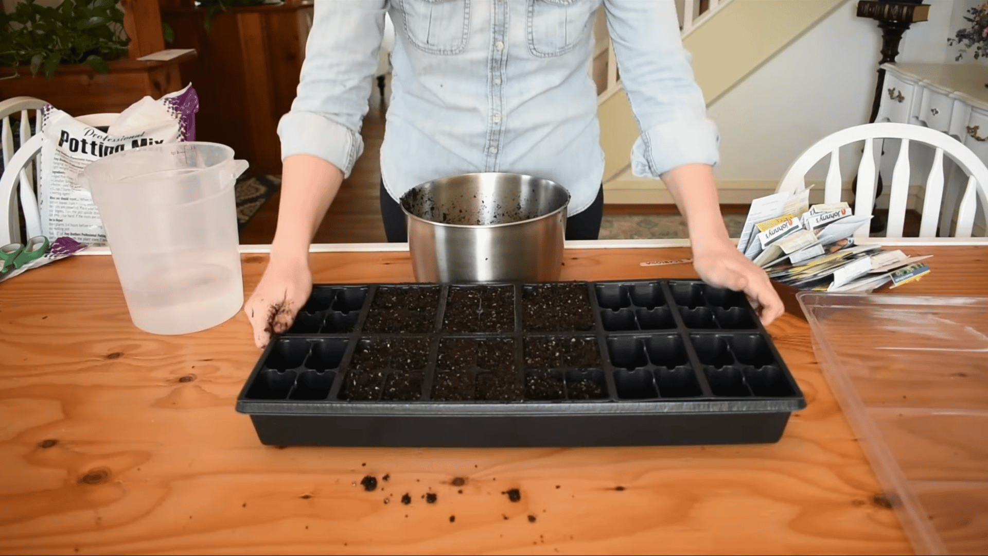 seed trays filled to the top with moist soil and gently tapped to remove air pockets before planting seeds indoors properly