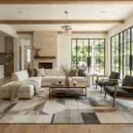 spacious modern living room with a large patterned rug, natural light, and clean layout showing style and custom fit of ernesta rugs