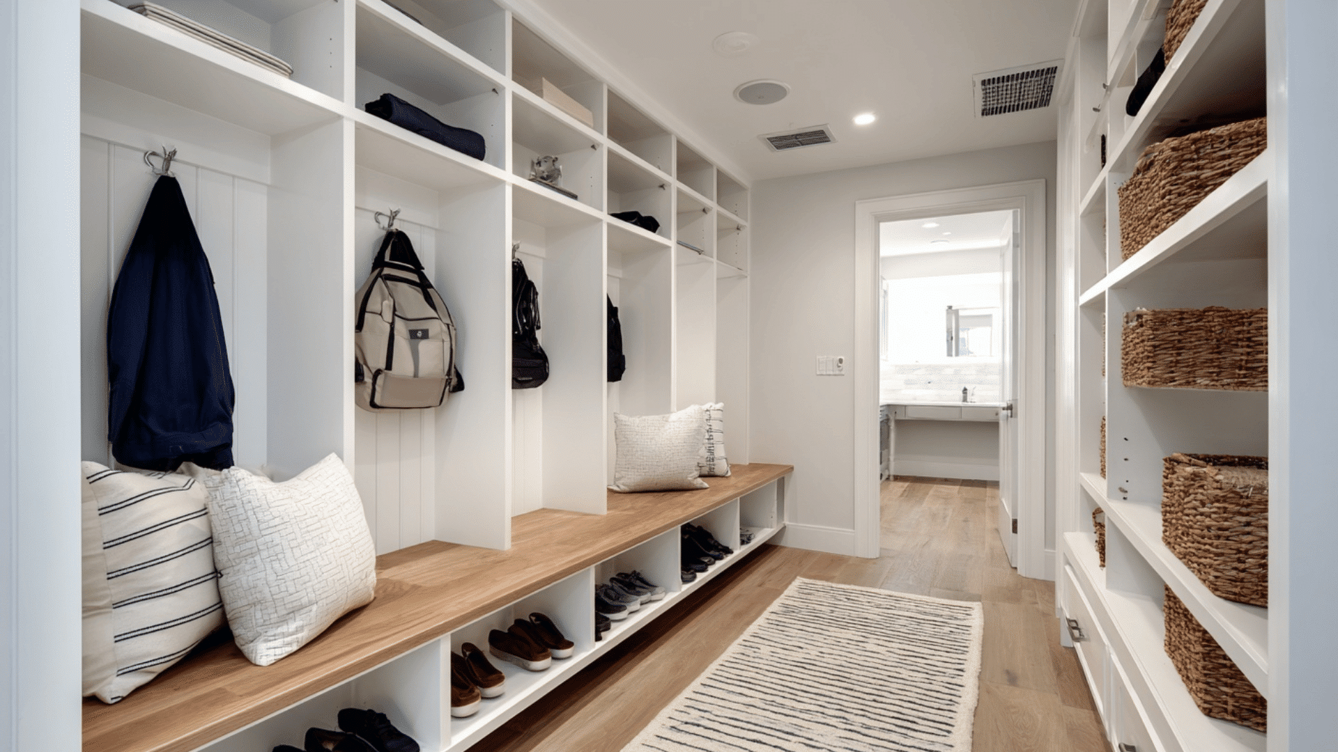 spacious walk in mud room with organized storage zones