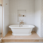 standard bathtub length shown in a clean residential bathroom with a white alcove tub installed between three tiled walls