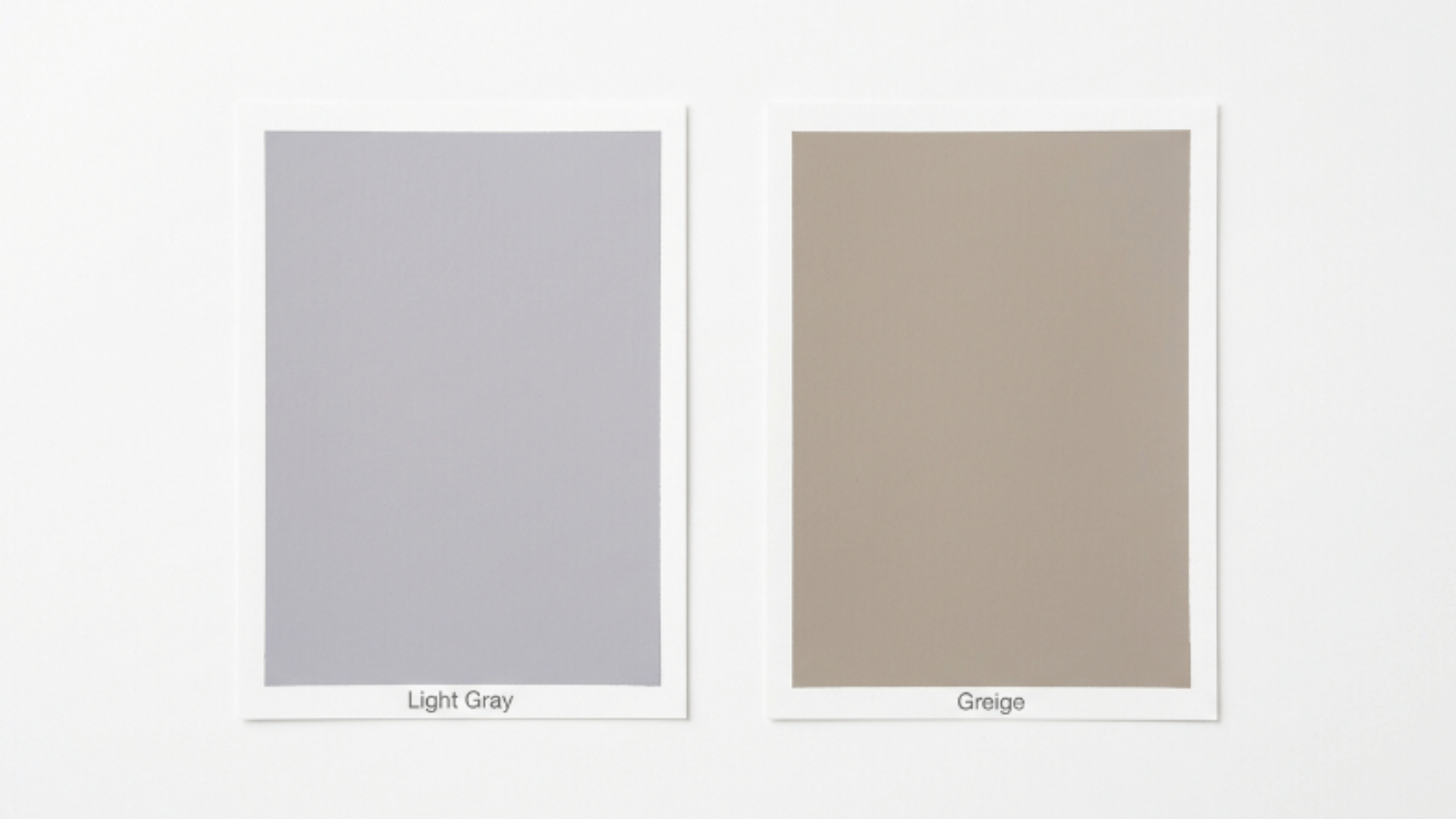 two paint swatches side by side on a light background, showing light gray on the left and greige on the right with subtle labels underneath (1)