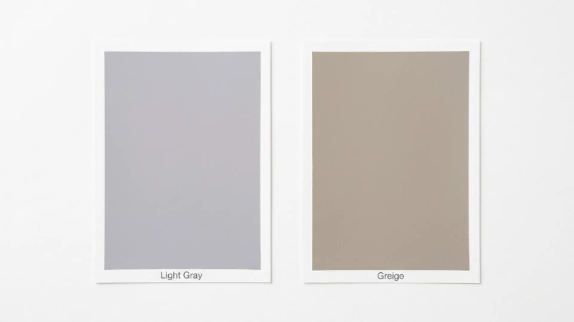 two paint swatches side by side on a light background, showing light gray on the left and greige on the right with subtle labels underneath (1)