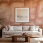 warm minimalist living room with blush textured accent wall, neutral sofa, wooden furniture, and soft natural light creating a calm inviting space
