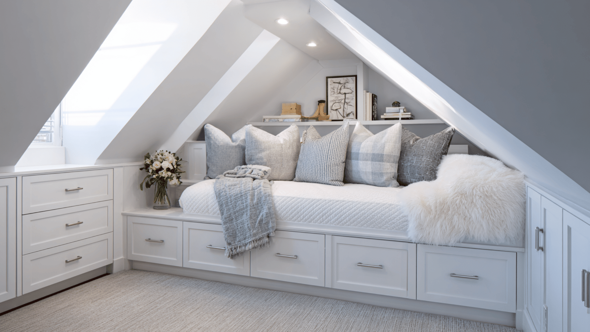 attic bedroom with built-in storage under eaves