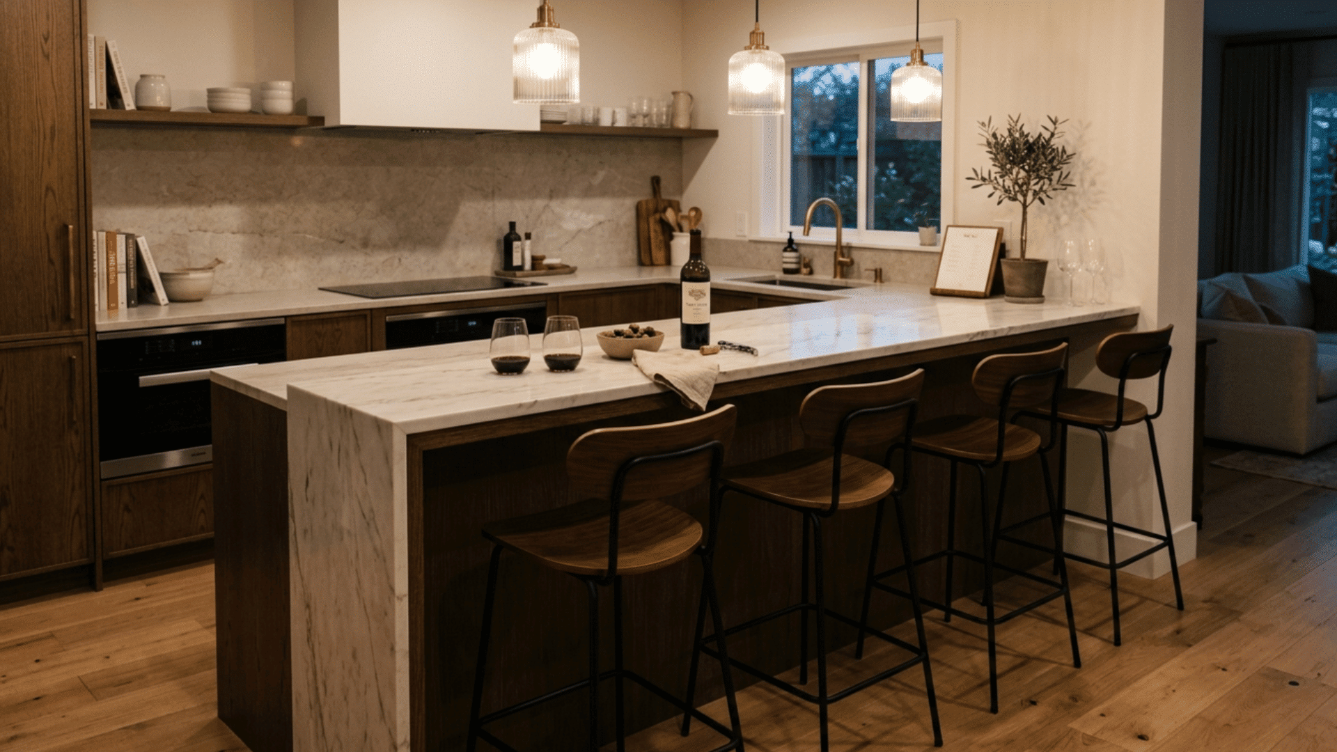 Bar height kitchen counter with tall stools creating an elevated seating and social space
