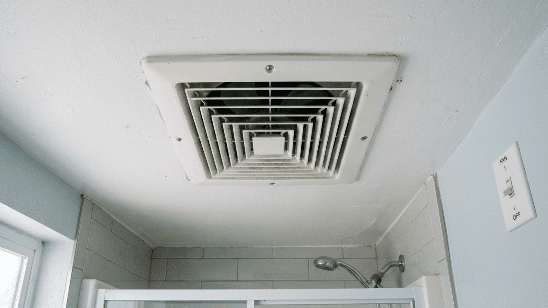 bathroom ceiling exhaust fan turned off above shower area.