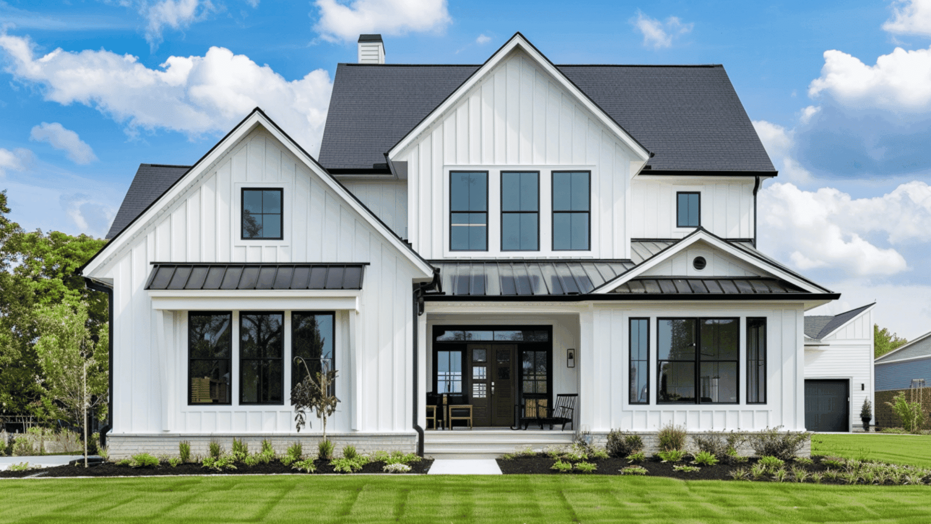 board and batten siding on modern farmhouse with white panels and black trim clean exterior design style