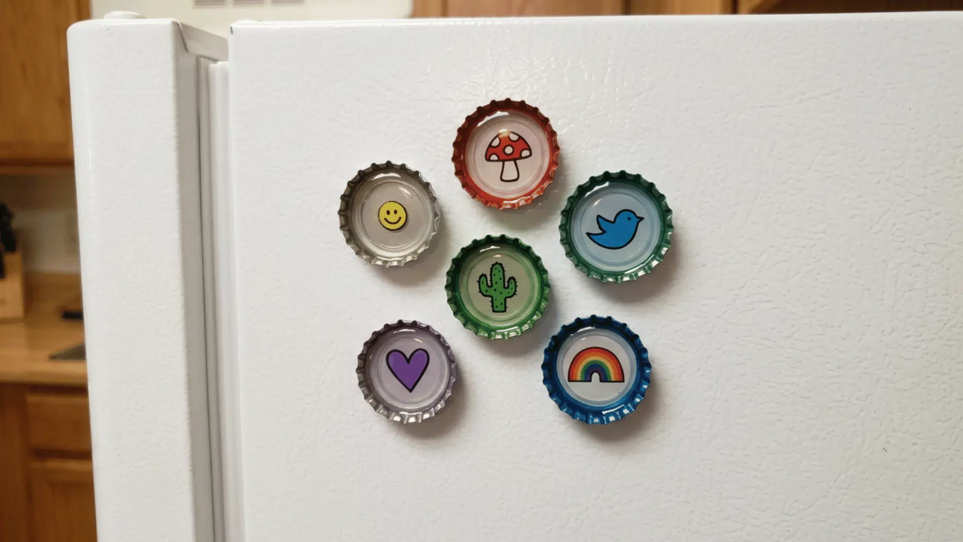bottle cap magnets with small designs attached on fridge in colorful setup