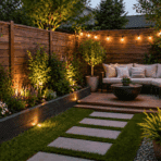 Cozy small backyard with wooden fencing, warm string lights, lush plants, stone path, and compact seating area for relaxing outdoors at dusk