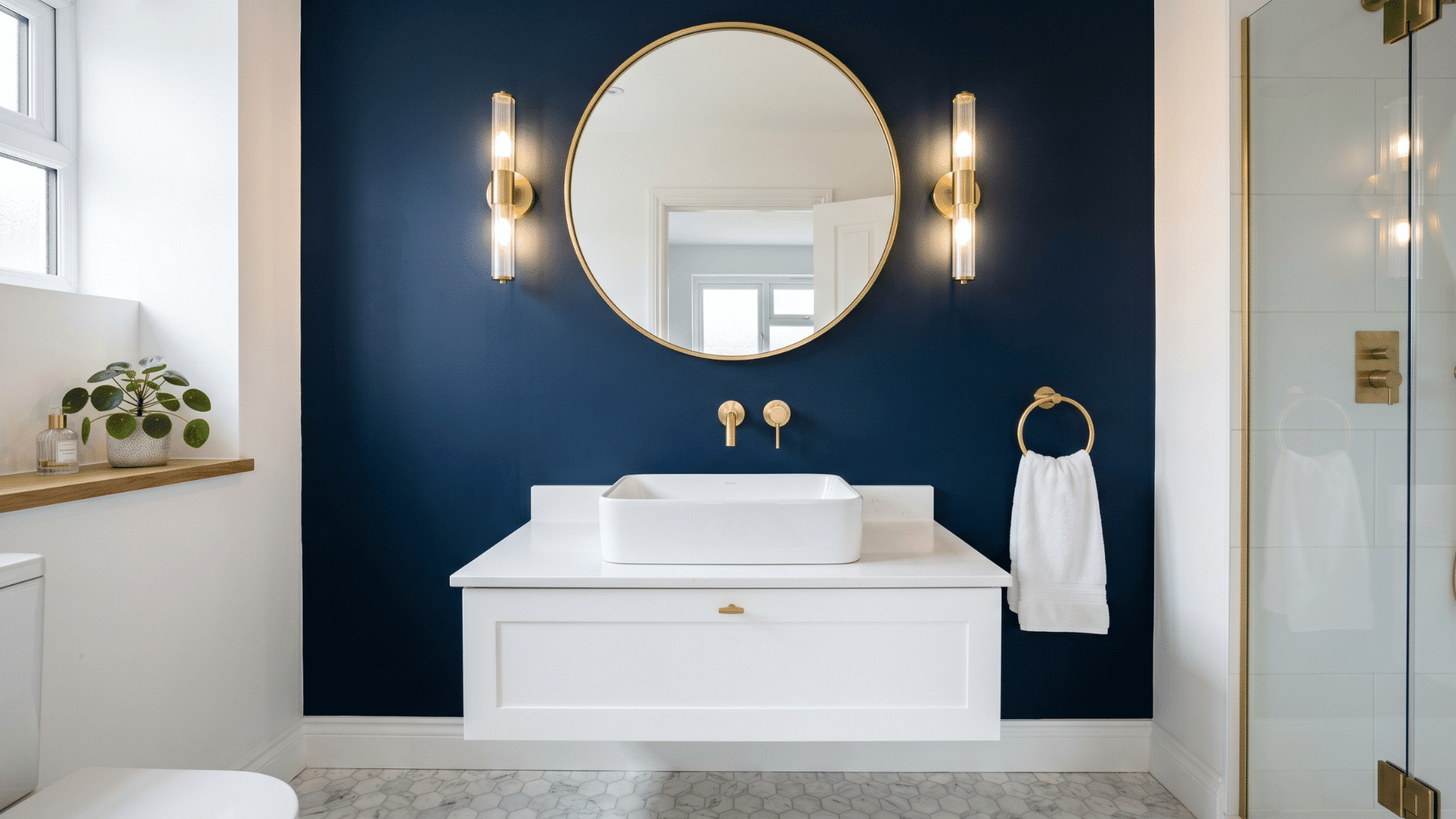 deep navy blue accent guest bathroom with gold fixtures white contrast clean front view (1)
