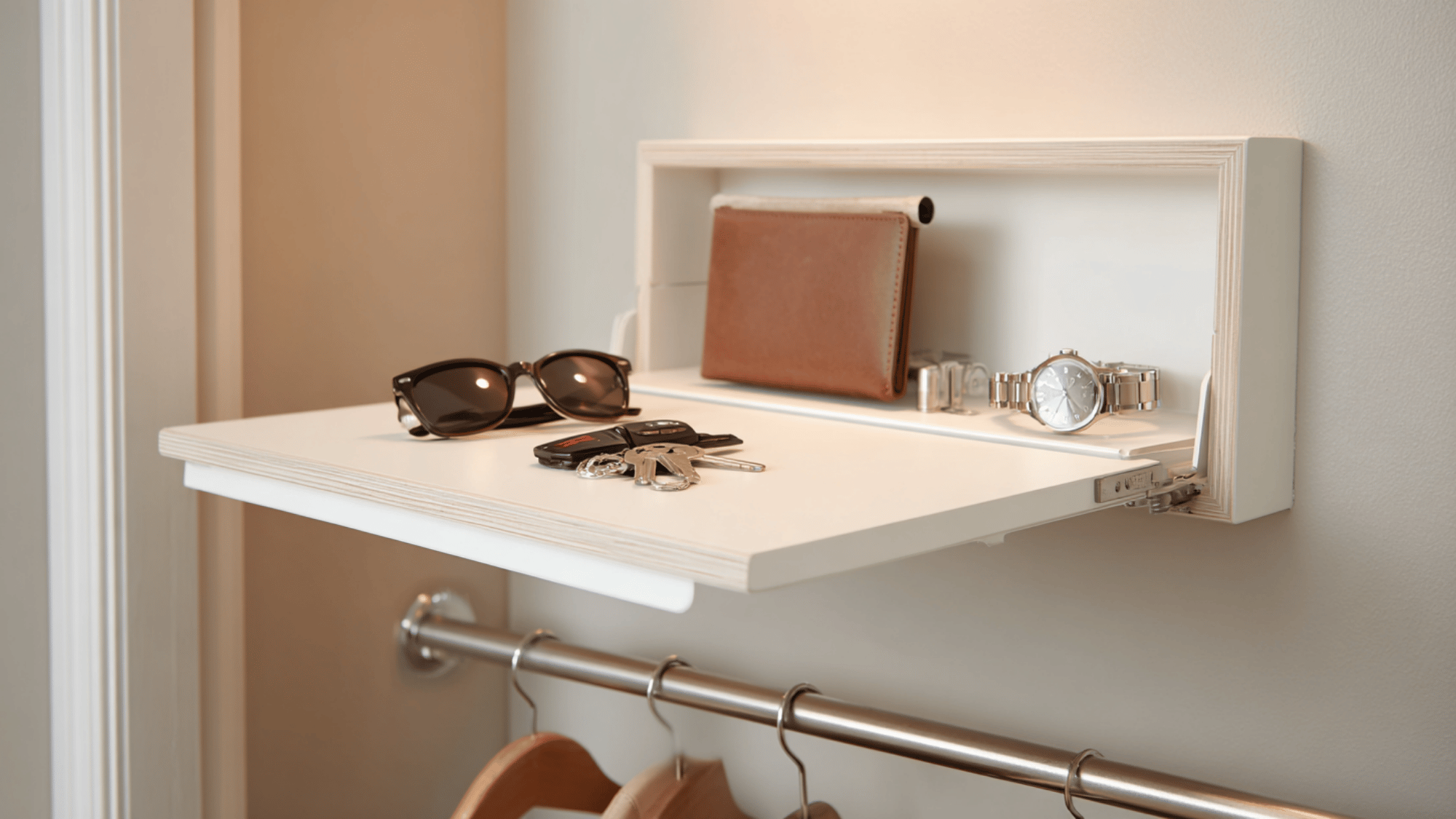 _fold-down wall valet installed inside a small walk-in closet for a dedicated accessory and outfit preparation station.