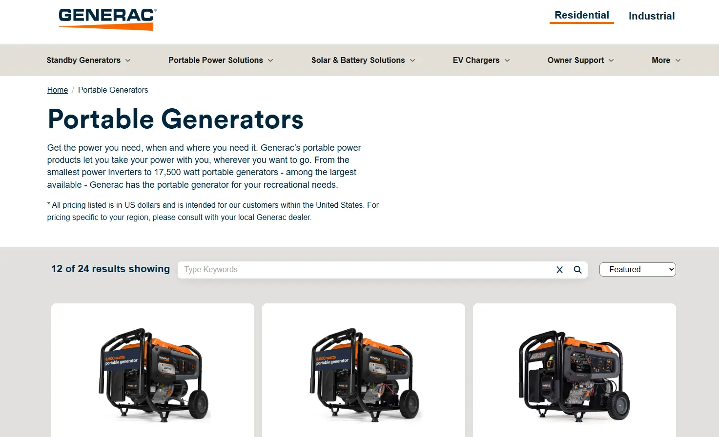 Portable generators on display with orange and black details and visible wattage labels