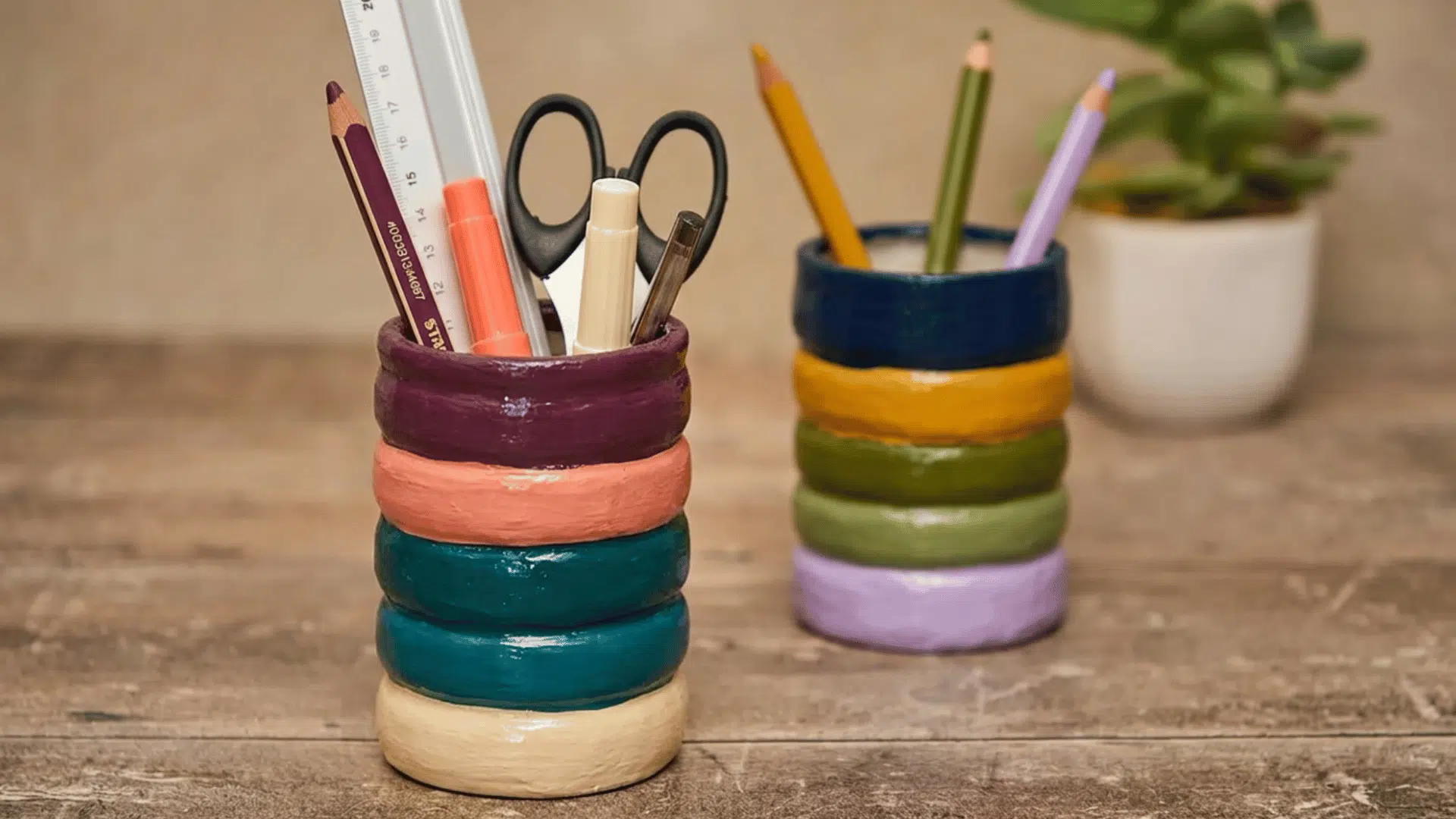 handmade plaster pen holder with textured finish placed on desk in creative workspace