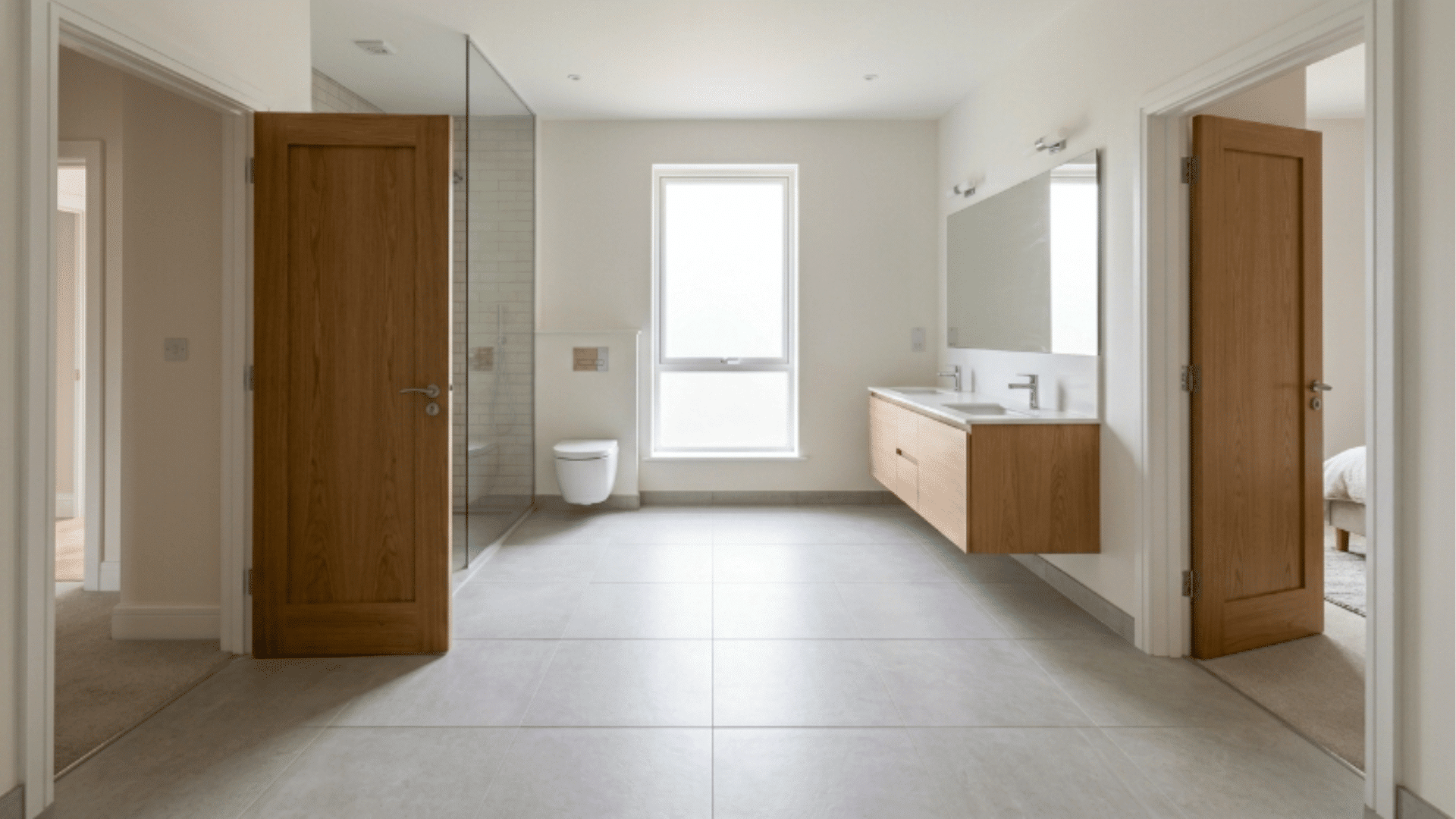 jack and jill bathroom with diagonal corner doors creating an open central space
