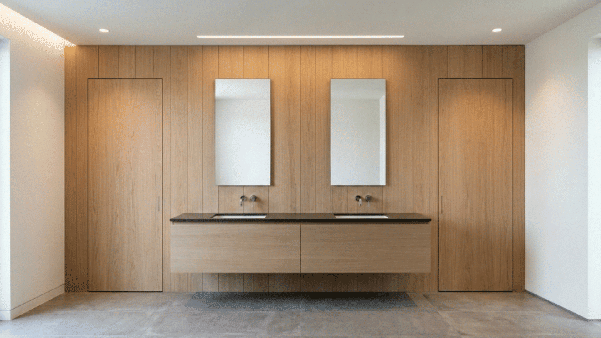 jack and jill bathroom with doors blending into walls for a clean look