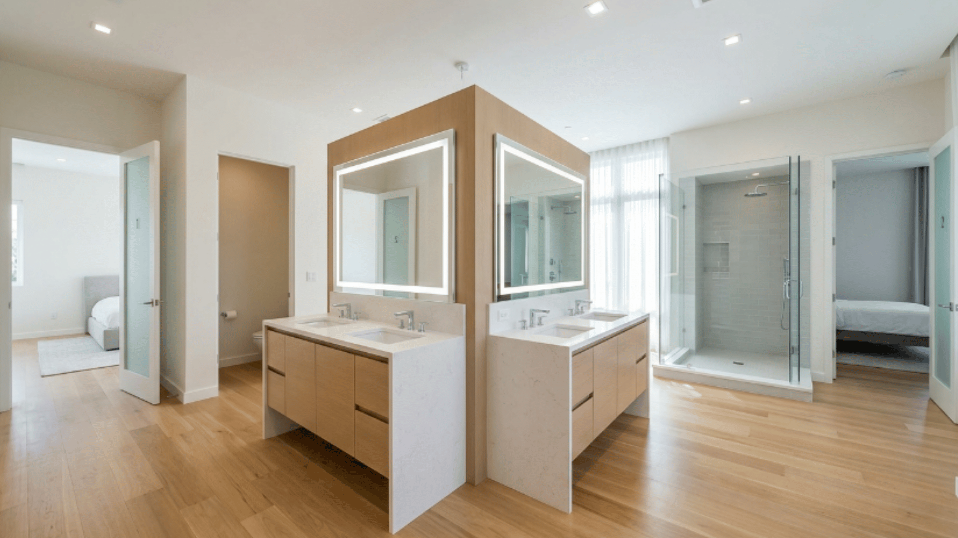 jack and jill bathroom with fixtures arranged back to back in the center (1)