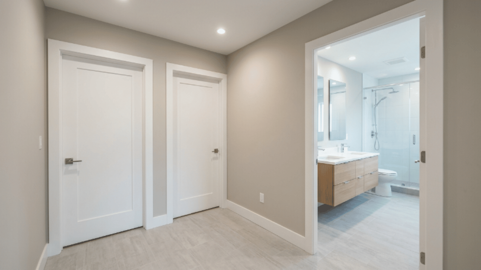 jack and jill bathroom with shared vestibule entry before main bathroom area
