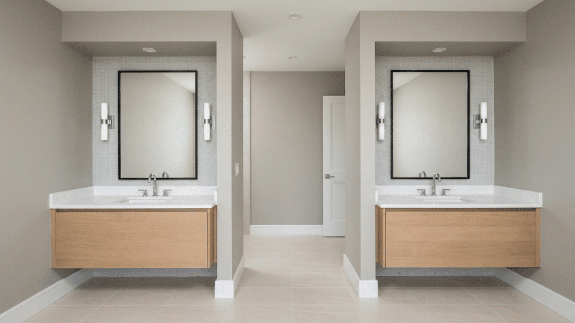 jack and jill bathroom with two recessed alcoves for separate sink spaces