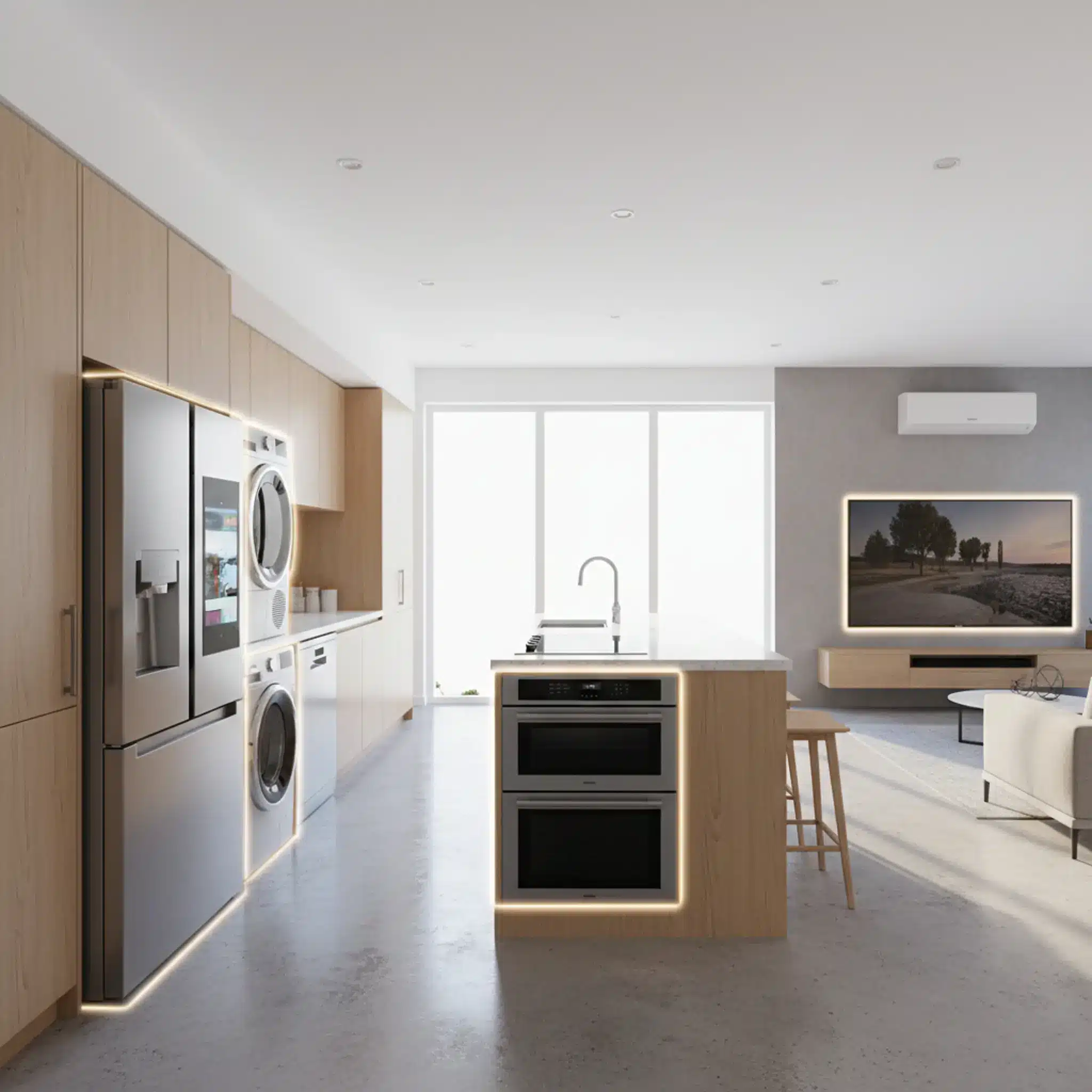Modern open-concept kitchen with stainless steel appliances and light wood cabinetry in a bright setting