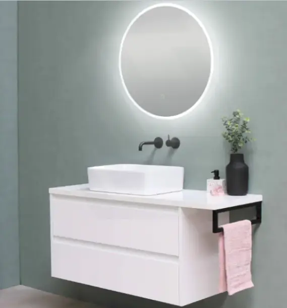 Modern bathroom vanity with round backlit mirror and white sink against gray wall