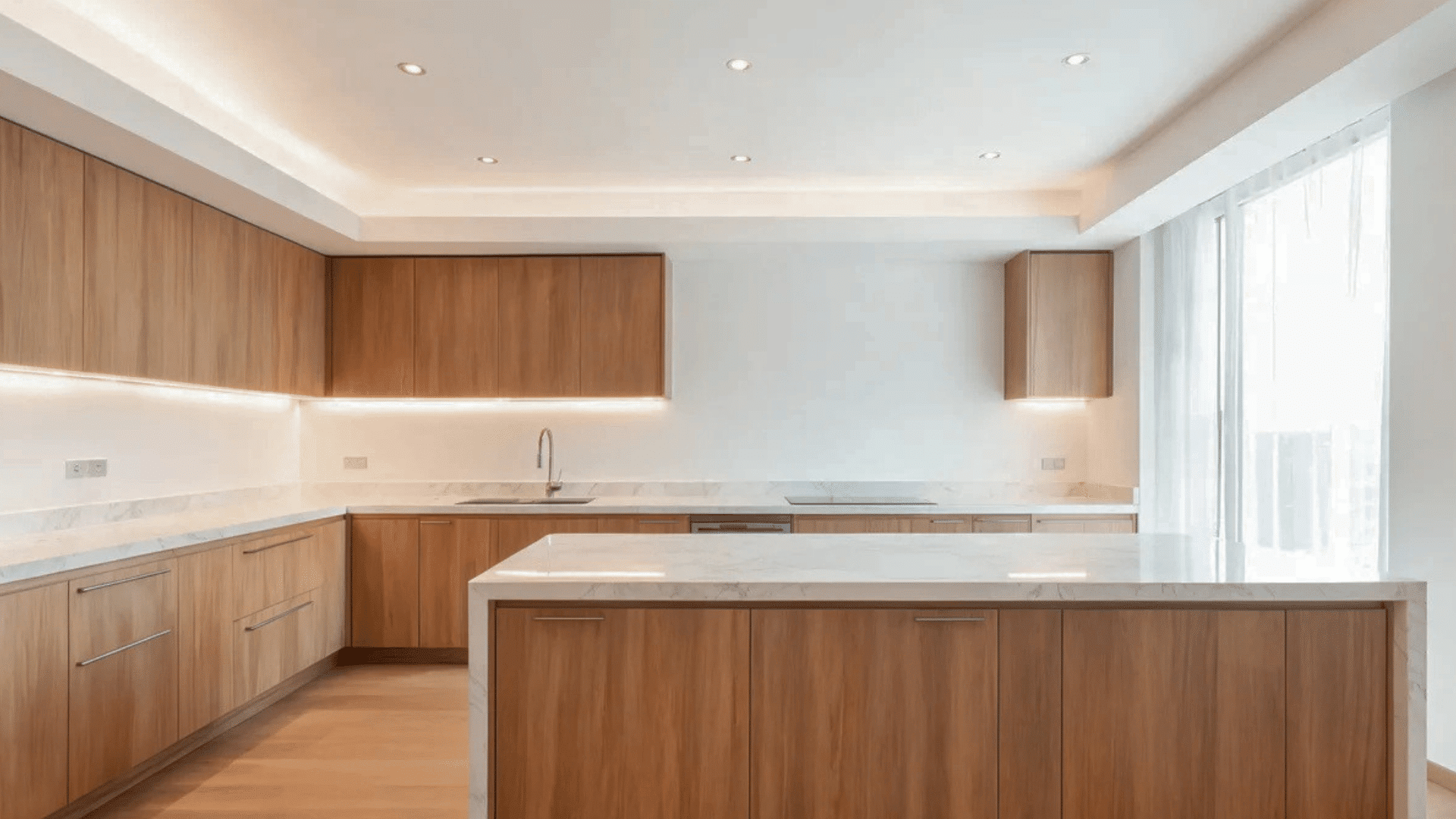 modern kitchen with wooden cabinets marble countertops and kitchen island